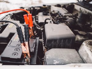 Car Jump Start Service With Cables On Battery