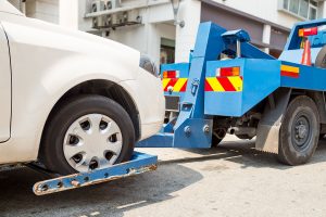 Wheel Lift Tow Truck At Work